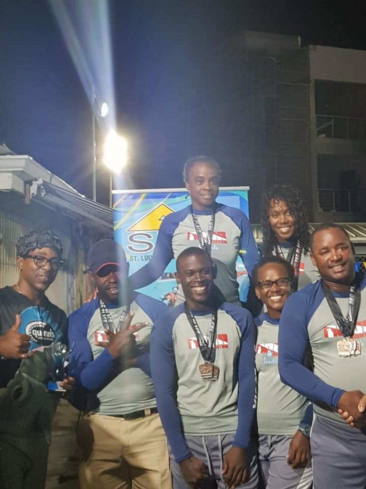 St. Lucia Aquatics Federation Awards Team Sandals with the Trophy for the 2nd Annual Inter Commercial Swim Championship